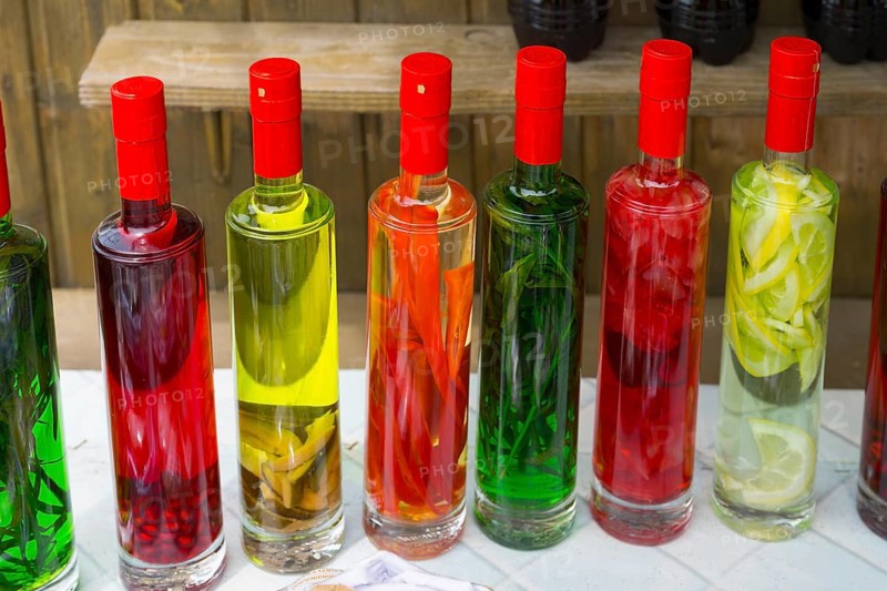 Close-up of colorful bottles filled with pickled fruits, chacha with colorful fruits, vegetables or spices, pomace brandy, grape distillate, Mtskheta, Mtskheta, Mtskheta, Mtskheta-Mtianeti region, Georgia