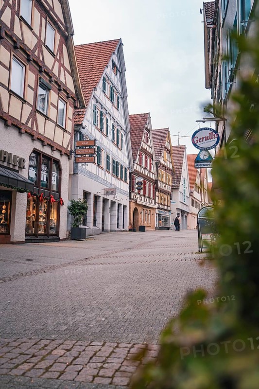 Malersische Altstadtstraße with half-timbered houses and shops, Herrenberg, Böblingen district, Germany