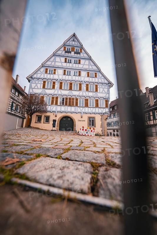Large half-timbered house with symmetrical façade and grid in the foreground in a historic old town, Herrenberg, Böblingen district, Germany