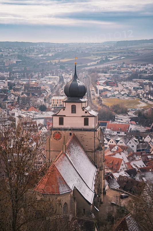 Panorama of the city with a church tower standing in the foreground and winter atmosphere, Herrenberg, Böblingen district, Germany