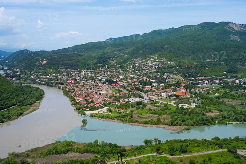 Extensive landscape with river and city in the valley surrounded by mountains, confluence of Kura and Aragwi, Mtskheta, Mtskheta, Mtskheta-Mtianeti region, Georgia