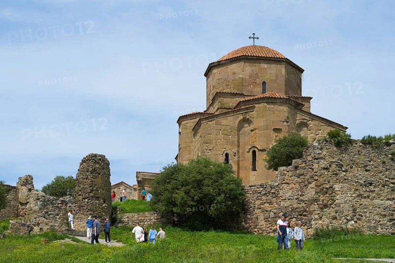 Old church and ruins in green landscape with people outdoors, Javari Monastery, Jvari Monastery, Dzhwari Church, Cross Monastery, UNESCO World Heritage Site, Mtskheta, Mtskheta, Mtskheta, Mtskheta-Mtianeti Region, Georgia