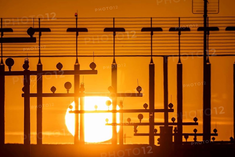 Runway lighting, approach aids, at Düsseldorf International Airport, sunset, Hauptbahn Süd, 05R/23L, North Rhine-Westphalia, Germany