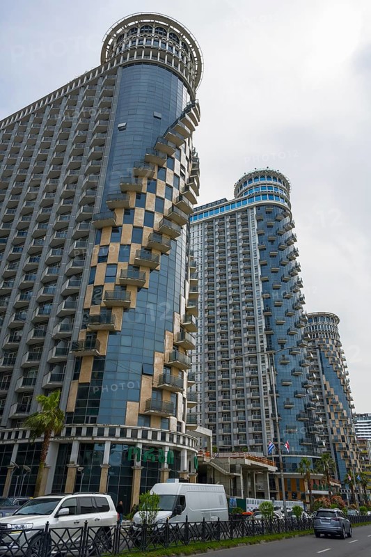 Modern skyscrapers with spiral balconies dominate the city skyline under cloudy sky, Orbi Sea Towers, Batumi, Black Sea, Ajara region, Adjara, Autonomous Republic, Georgia