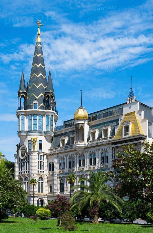 Tower with golden dome in an impressive building with palm trees, Astronomical Clock, Black Gold Roof, Europe Square, Batumi, Black Sea, Ajara Region, Adjara, Autonomous Republic, Georgia