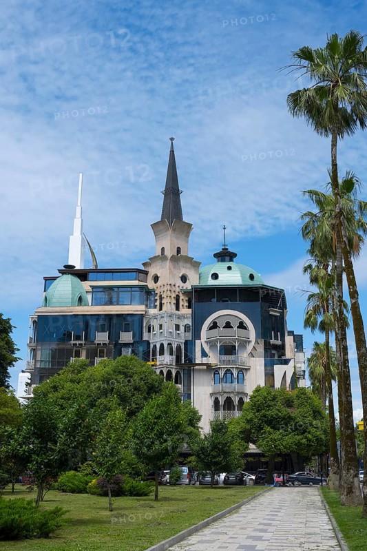Historically inspired building with tower and palm trees, former registry office, now administrative building of the government of Adjara, Batumi, Black Sea, Ajara region, Adjara, autonomous republic, Georgia