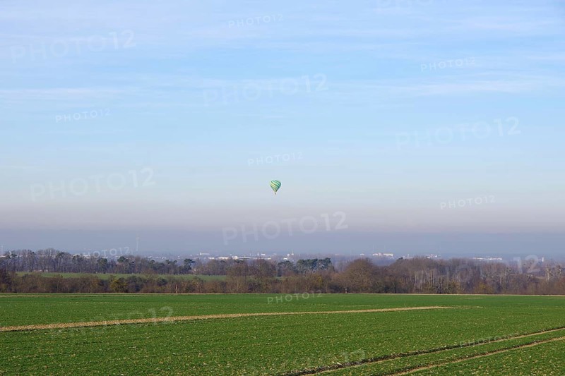 Hot air balloon, landscape, winter, in the sky, colors, atmospheric, North Rhine-Westphalia, Germany, A balloon floats in the air over fields, trees and houses