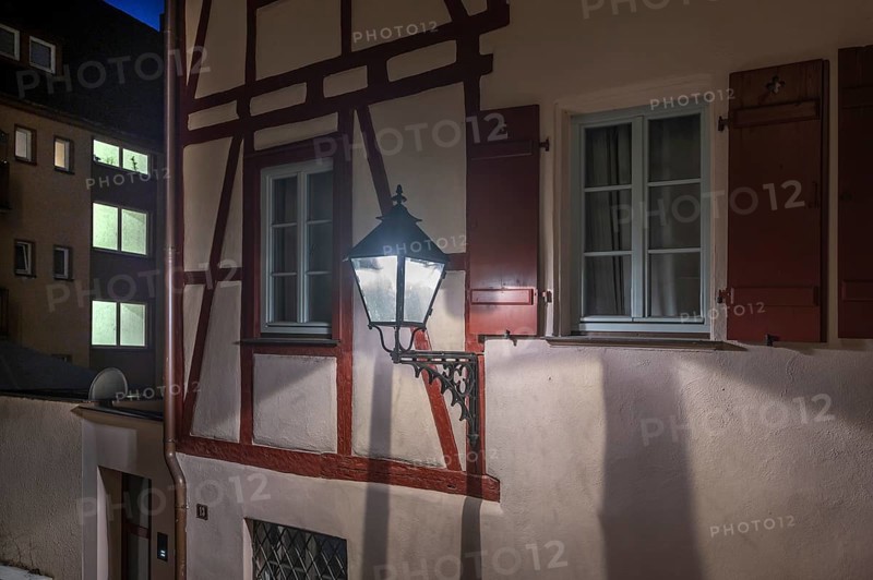 Old lantern on an old half-timbered house, Nuremberg, Middle Franconia, Bavaria, Germany