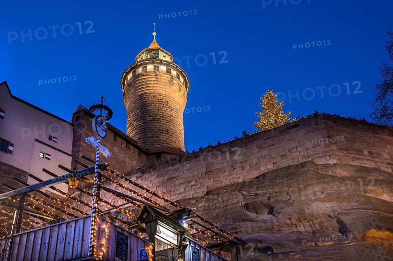Illuminated Sinwell Tower, built in the 13th century, blue evening sky, Kaiserburg, Nuremberg, Middle Franconia, Bavaria, Germany