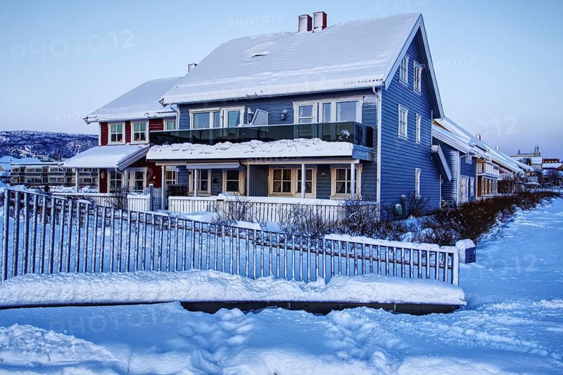 Snowy blue house in winter, Mo i Rana, Norway