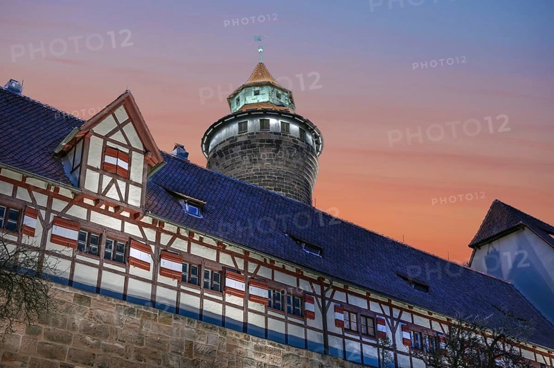 Sinwell Tower built in the 13th century, on the Nuremberg Kaiserburg in the evening lighting, red evening sky, Mount of Olives, Nuremberg, Middle Franconia, Bavaria, Germany