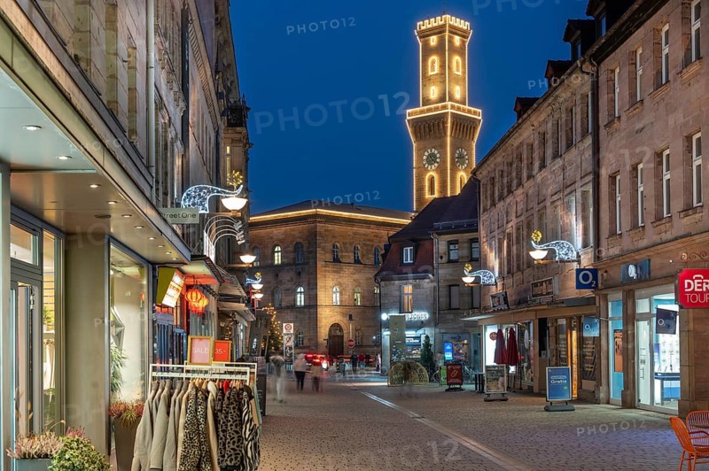 Pedestrian zone in evening lighting, the illuminated town hall tower at the back, blue evening sky, Fürth, Middle Franconia, Bavaria, Germany