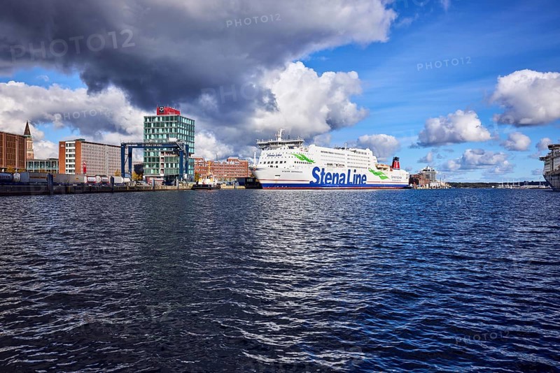 Kiel Fjord, Stena Germanica ferry, Stena Line GmbH, ferry, port house, high-rise building, modern architecture, general development, port, wharf, portal crane, seaport Kiel GmbH and Co. KG, water surface with small waves, blue sky, cumulus clouds, stratocumulus clouds, white and dark clouds, Kiel, state capital, district-free city, Schleswig-Holstein, Germany