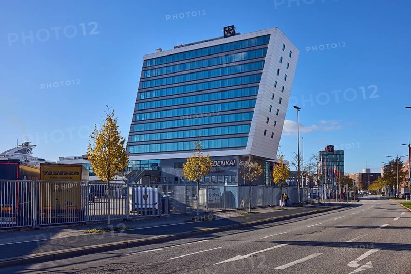 Schwedenkai ferry terminal, general development, commercial building, modern architecture, lanes, lantern, metal fence, trees, blue sky, cloudless, Kaistraße, Kiel, state capital, district-free city, Schleswig-Holstein, Germany