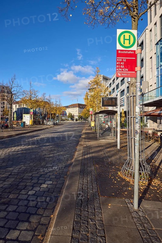 Bootshafen bus stop, public transport NAH.SH, general architecture, modern buildings, cobblestone roadway, trees, blue sky, cumulus clouds, Wall street, Kiel, state capital, district-free city, Schleswig-Holstein, Germany