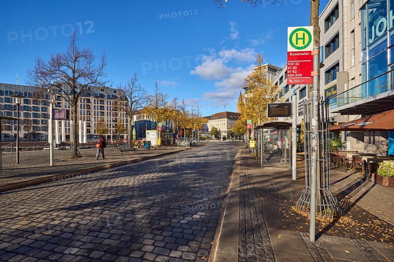 Bootshafen bus stop, public transport NAH.SH, general architecture, modern buildings, cobblestone roadway, trees, blue sky, cumulus clouds, Wall street, Kiel, state capital, district-free city, Schleswig-Holstein, Germany