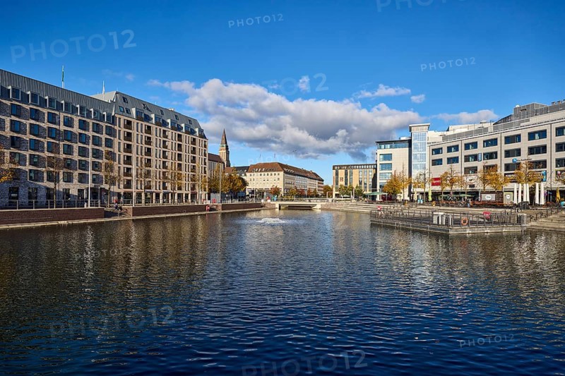 Boat harbor, triangular water area, general architecture, commercial buildings, modern buildings, abstract reflections on the water surface, seating steps, façade with windows, blue sky, cumulus clouds, street wall, Berliner Platz and Holstenbrücke, Kiel, state capital, district-free city, Schleswig-Holstein, Germany