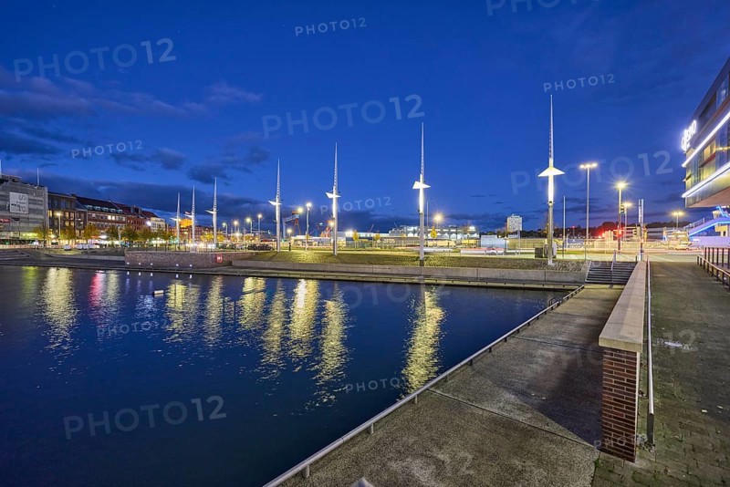 Boat harbor, water area, general architecture, modern buildings, abstract reflections on the water surface, evening blue hour, deep blue evening sky, cumulus clouds, quay road, Kiel, state capital, district-free city, Schleswig-Holstein, Germany
