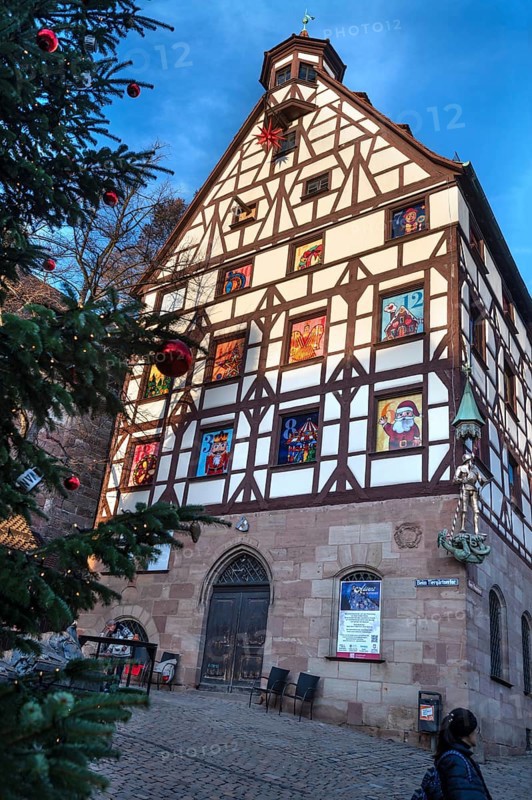 Historic Pilate House with the annual advent calendar in the evening light, Tiergärtnertor, Nuremberg, Middle Franconia, Bavaria, Germany