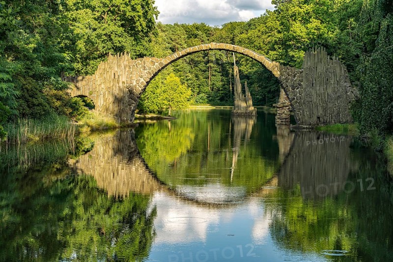 The Rakotz Bridge or Devil's Bridge on Lake Rakotz in the Kromlau Azalea and Rhododendron Park, Upper Lusatia, Gablenz, Saxony, Germany