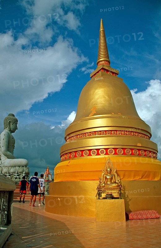 People, Buddha statue, chedi in Wat Tam Sua monastery, which is partly on the top of a mountain, Krabi, Thailand, December 2002, vintage, retro, old, historic