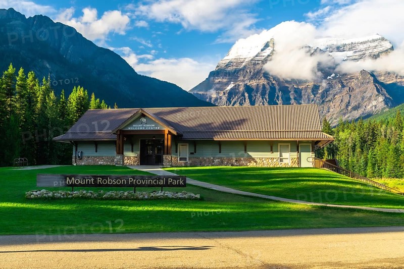 Mount robson provincial park welcome center building rising against majestic mountains and lush greenery, inviting exploration of british columbia's natural wonders