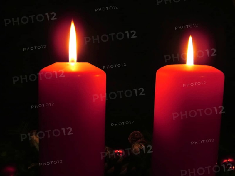 Two burning red candles create a calm and contemplative atmosphere in the dark, Advent wreath with two burning candles, light, lights, Christmas decorations radiate warmth, night, Christmas, advent, fire, flame, romantic, red wax, Christmas time, Christmas decoration, candlelight, Germany