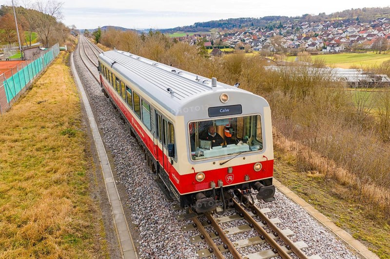 Train on the rails with a view of the city and countryside in the background, inscription 'Calw', historic event, first test run with a passenger train on the Hermann tracks, Hesse Railway since 1988, Calw district, Germany