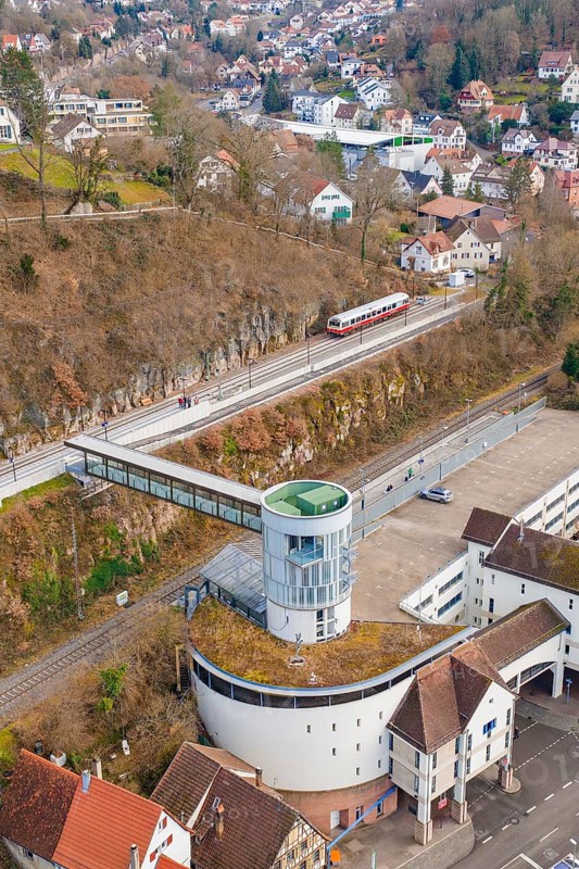 Architecture and a train on an elevated position with a view of houses and other buildings, historic event, first test run with a passenger train on the Hermann tracks, Hesse Railway since 1988, Calw, Calw district, Germany