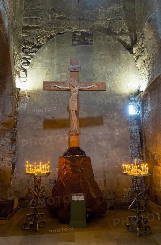Interior of a church with a wooden cross and candlesticks on both sides, intimate religious atmosphere, Svetitskhoveli Cathedral, Svetitskhoveli, UNESCO World Heritage Site, Mtskheta, Mtskheta, Mtskheta-Mtianeti region, Georgia