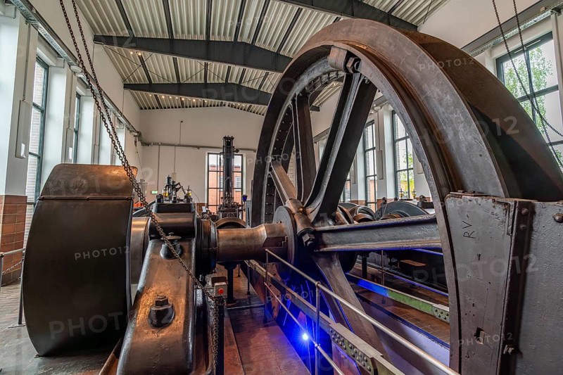 Large steel wheel of a steam engine in the coal world, Steinkohlebergbau Sachsen Museum, Oelsnitz im Erzgebirge, Saxony, Germany