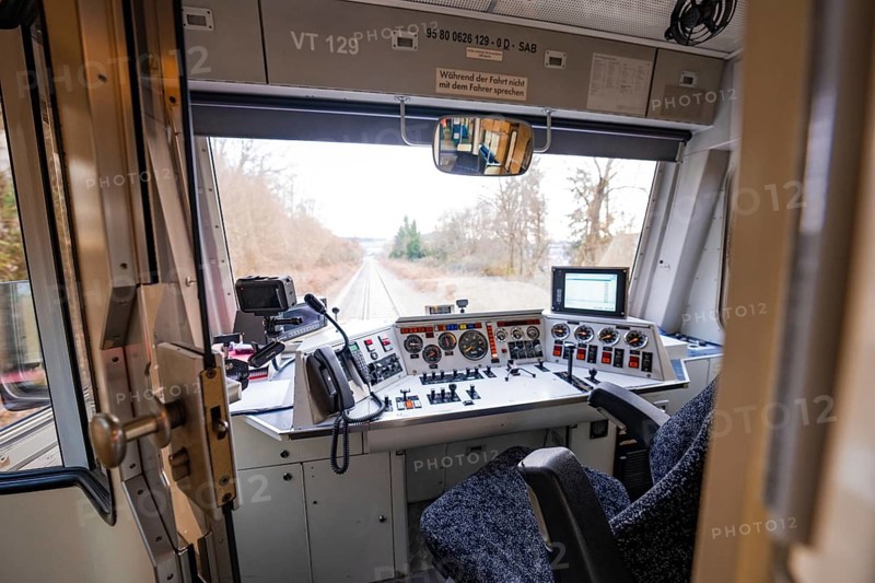 Train driver's cab with various control elements and view of the line through windows, historic event, first test run with a passenger train on the Hermann tracks, Hesse Railway since 1988, Calw district, Germany
