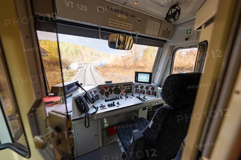 Driver's cab of a train with a view of the rails, technical instruments and control elements available, historic event, first test run with a passenger train on the Hermann tracks, Hesse Railway since 1988, Calw district, Germany