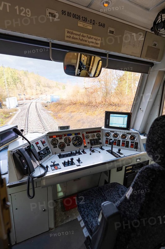 View from the train driver's cab on rails, with complex control panel and technology in the foreground, historic event, first test run with a passenger train on the Hermann tracks, Hesse Railway since 1988, Calw district, Germany