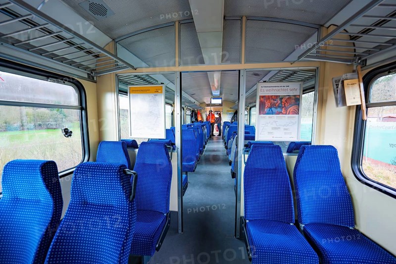 Neatly arranged blue seats inside a train with lots of daylight, historic event, first test run with a passenger train on the Hermann tracks, Hesse Railway since 1988, Calw district, Germany