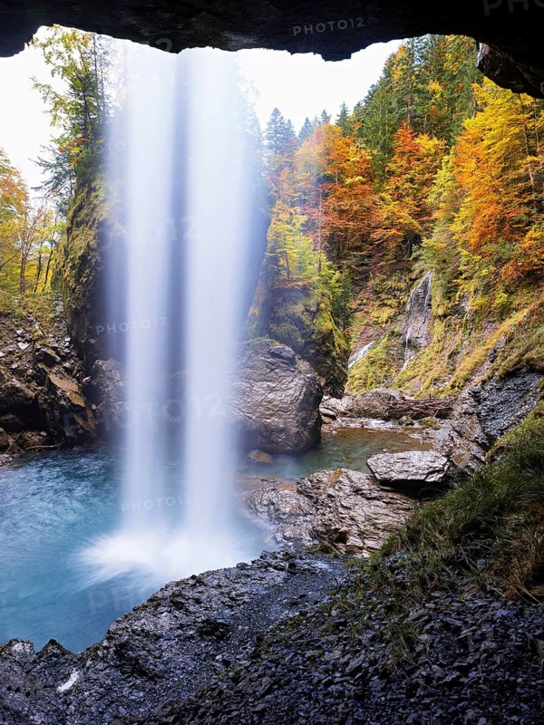 Waterfall mountain list in autumn-colored surroundings, Linthal, Klausenpass, Canton of Glarus, Switzerland