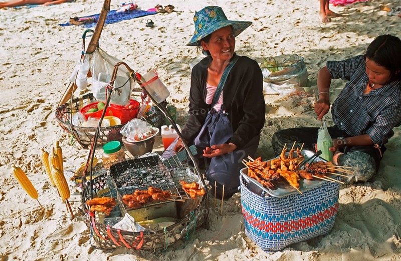 Woman and daughter with food stash on Pranang Cave beach, two years in front of the tsunami, Krabi, Thailand, December 2002, vintage, retro, old, historic