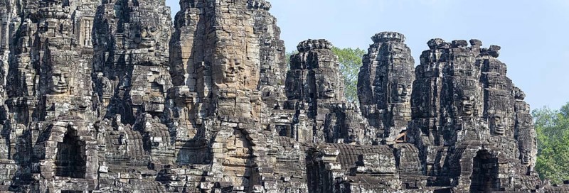 Panoramic picture of huge stone-carved faces of Bodhisattva Lokeshvara, also Avalokiteshvara, Bayon Temple, Angkor Thom, UNESCO World Heritage Site, Angkor Wat, Siem Reap, Cambodia