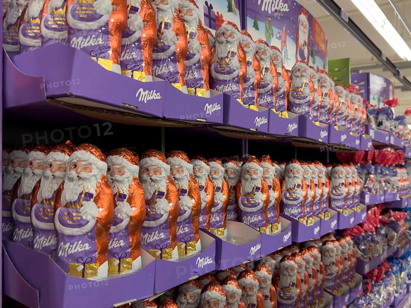 Huge large shelf with chocolate Santa Claus chocolate Santa Claus chocolate Santa Claus chocolate Santa Claus chocolate Santa Claus candy from brand Milka from US group Mondelez International, international
