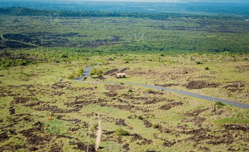 Landscape of a rural road surrounded by vegetation. View of an asphalt road in a green and natural place, Aerial view of an asphalt road in a rural location