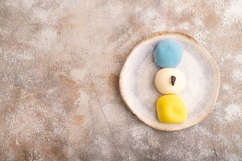 Japanese Mochi Cakes on brown concrete background, top view, flat lay, copy space