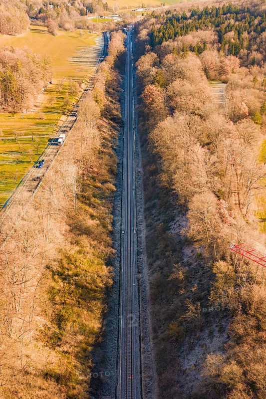 A railway line stretches through a dense forest landscape in winter, construction of the Hermann Hesse Railway, Calw, Germany