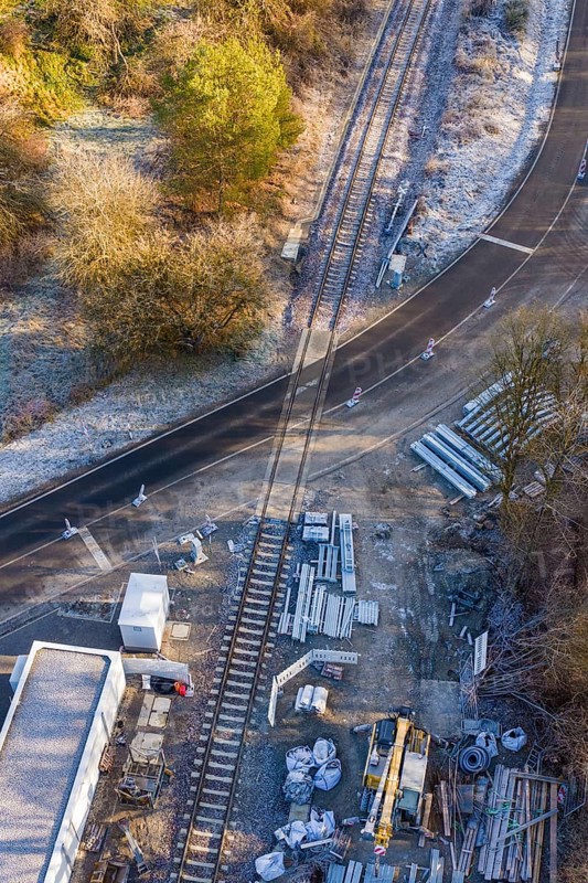 Construction site on a railway line with building materials next to a road, construction of the Hermann Hesse Railway, Calw, Germany
