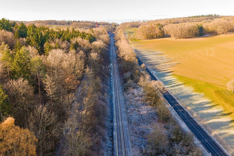 Railway line between trees and a country road surrounded by nature, construction of the Hermann Hesse Railway, Calw, Germany
