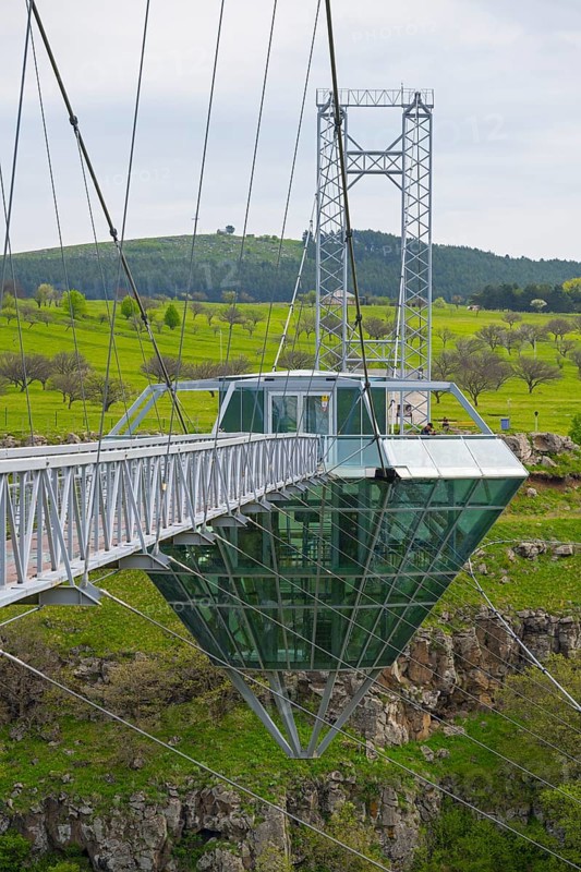 Bridge with glass structure over a green landscape and hills, diamond bridge, Diamond Glass Bridge, world's longest free-hanging structure, Dashbashi Gorge, Khrami River, Tsalka Nature Reserve, Kartli, Georgia