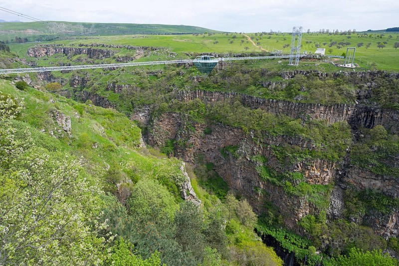 Suspension bridge stretches over a deep, green gorge with surrounding nature, Diamond Bridge, Diamond Glass Bridge, world's longest free-hanging structure, Dashbashi Gorge, Khrami River, Tsalka Nature Reserve, Kartli, Georgia