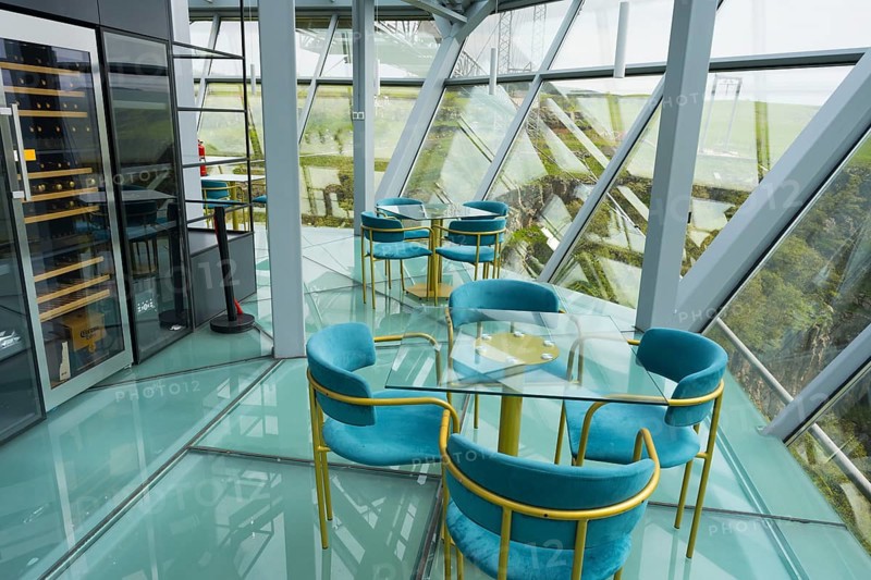 A modern café with glass floors and blue chairs offers impressive views, Diamond Bridge, Diamond Glass Bridge, world's longest free-hanging structure, Dashbashi Gorge, Khrami River, Chrami, Tsalka Nature Reserve, Kartli, Georgia