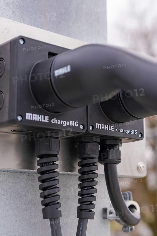 Close-up of charging stations with two black cables, mounted on metal, parking garage construction with charging infrastructure, Calw, Germany