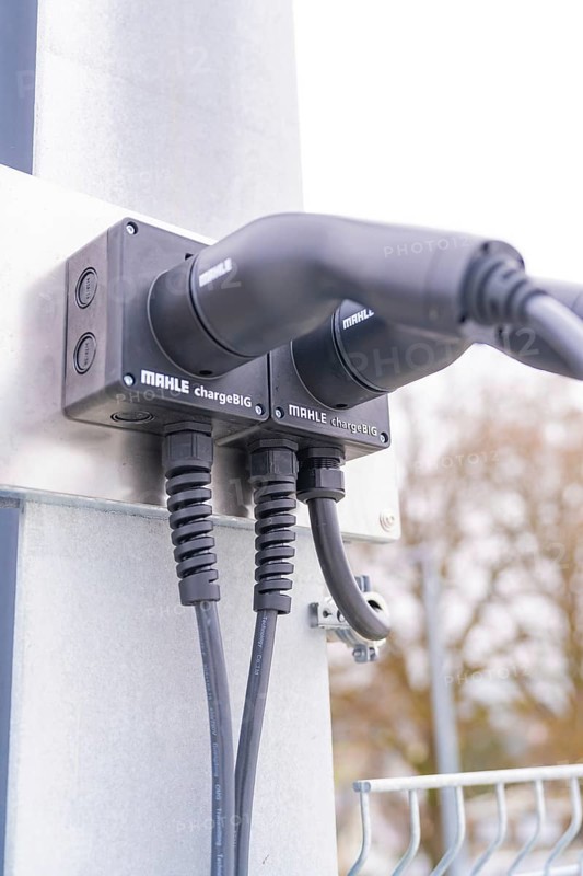 Modern electric charging station with cable connections on metal, parking garage construction with charging infrastructure, Calw, Germany