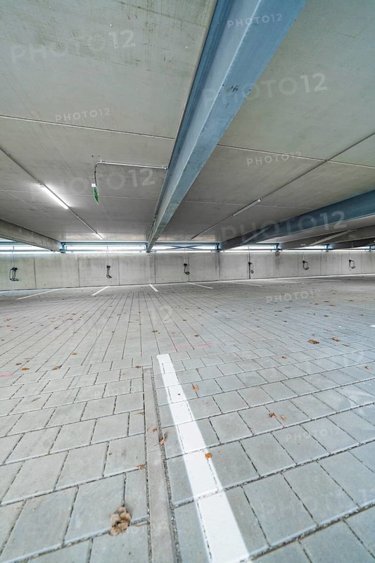 Empty interior of a parking garage with concrete walls and ceiling, parking garage construction with charging infrastructure, Calw, Germany